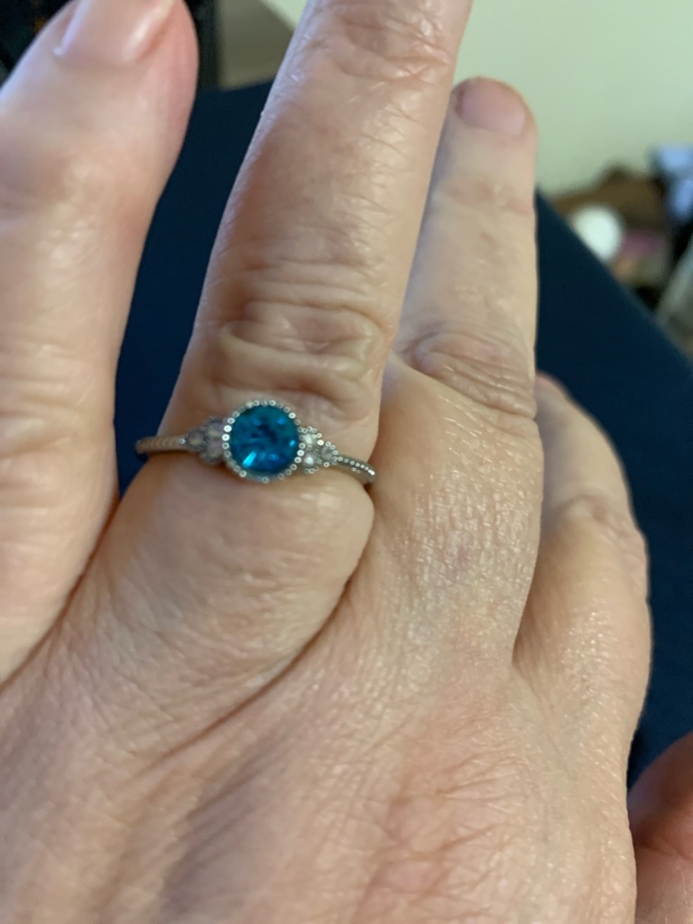Blue Halo Solitaire Ring - Elegant Silver-Accent Design